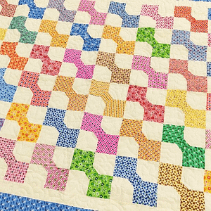 Traditional Scrap Color & Cream Bow Tie pattern – Twin size FINISHED QUILT